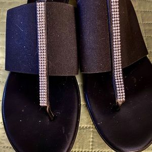 Beautiful black backless sandal with rhinestone trim.